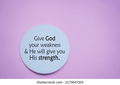 Spiritual Text Message On A Circle Paper - Give God Your Weakness And He Will Give You His Strength. Christianity Quote On Soft Pink Purple Background. Believe In God Concept.