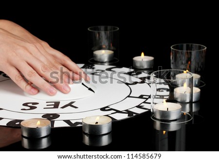 spiritualistic seance by candlelight close-up
