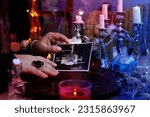 spiritualistic seance in salon of medium with old photographs of deceased relatives, Female Fortuneteller or esoteric Oracle, longing for ancestors, communication with world spirits, help of ancestors