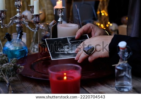 spiritualistic seance in salon of medium with old photographs, Female Fortuneteller, esoteric Oracle, communication with spirits, ancestors, help ancestors, Family Ritual Scripts, crown of celibacy