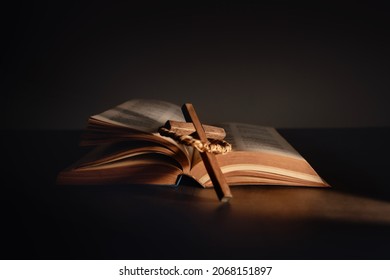 Spirituality, Religion and Hope Concept. Holy Bible and Cross on Desk. Symbol of Humility, Supplication,Believe and Faith for Christian People - Shutterstock ID 2068151897