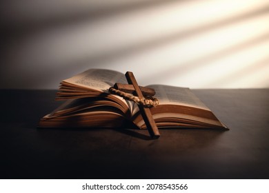 Spirituality, Religion and Hope Concept. Holy Bible and Cross on Desk. Symbol of Humility, Supplication,Believe and Faith for Christian People - Shutterstock ID 2078543566