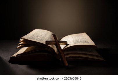 Spirituality, Religion and Hope Concept. Holy Bible and Cross on Desk. Symbol of Humility, Supplication,Believe and Faith for Christian People - Shutterstock ID 2103605843