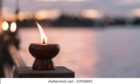 Spirituality, soul, world human spirit day and tranquility abstract concept with candle light illumination and golden sunset sky