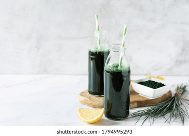 Spirulina Drink With Lemon And Spirulina Algae Powder On White Marble Table. Superfood, Detox Drink.