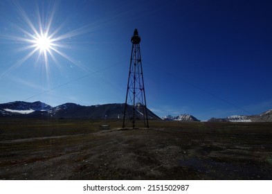 Ny-Ålesund, Spitsbergen, Svalbard - July 8 2016: Silhouette of the airship anchor mast which was used for flying to the North Pole twice, with the zeppelins Norge and Italia. Silhouette with blue sky.