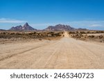 The Spitzkoppe in the desert. A group of bald granite peaks between Usakos and Swakopmund in the Namib desert of Namibia in the late afternoon. It is  The Spitzkoppe.