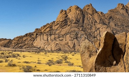 The Spitzkoppe mountain range in Namibia consists of pink smooth extraordinary boulders