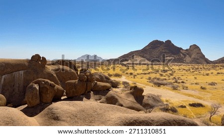 The Spitzkoppe mountain range in Namibia consists of pink smooth extraordinary boulders