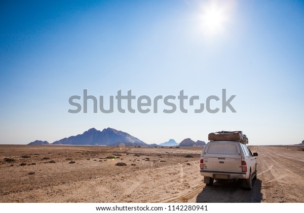 Spitzkoppe, Namibia -\
September, 2015: Typical rent car in Namibia equipped with\
everything necessary for a long trip: tents, sleeping bags,\
mini-fridge, heater etc near\
