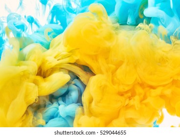 Splash Of Blue And Yellow Paint. Abstract Background