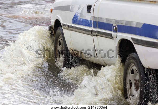 Splash by a car
as it goes through flood water
