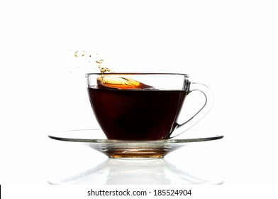 Splash Coffee In Glass Cup, Isolated On White Background.