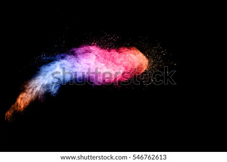 Splash of colorful powder ,Abstract art colored powder ,Frozen movement of dust explosion  on black background. 