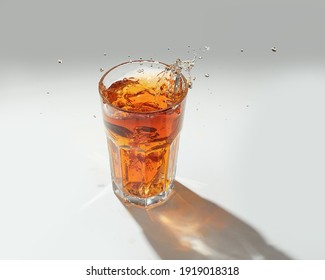 Splash Of Iced Tea Isolated On White Background.