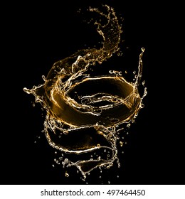 Splash Of Ink Isolated On Black Background. Beautiful Golden Splash Close-up. Golden Water Splash. Oil Splash. Water Spray With Drops Isolated.