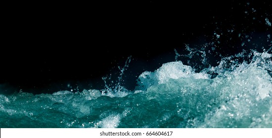 Splash Of Stormy Water In The Ocean On A Black Background