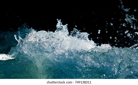 Splash Of Stormy Water In The Ocean On A Black Background