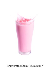 Splash of strawberry milk from the glass on isolated white background.