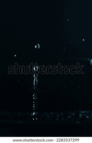 Splash water. Water drop splash close up on black background.