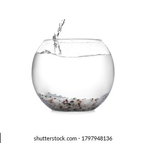 Splash Of Water In Round Fish Bowl With Decorative Pebbles On White Background