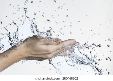 Splash Of Water In Woman Hand