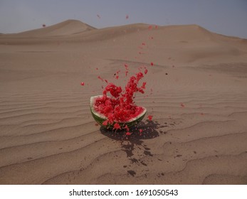 Splashed Watermelon in the desert background.