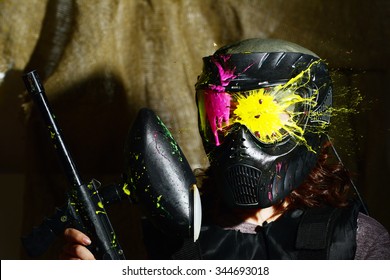 Splashes after direct hit to protecting mask in the paintball game 