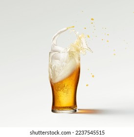 Splashes and drops. Glass of frothy light lager beer isolated over grey background. Popular drink. Concept of alcohol, oktoberfest, drinks, holidays and festivals. Copy space for ad. - Powered by Shutterstock