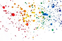 Splashes Of Paint On A White Background. Colored Spots Of Paint On A White Background. There Are Many Drops Of Colored Paint On White Paper.