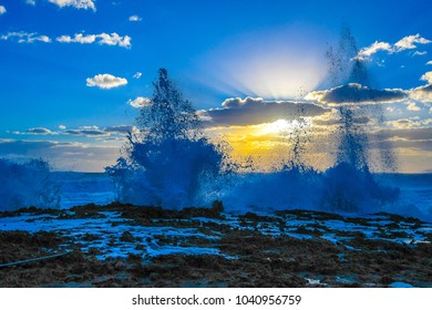 Splashes Reaching High In The Sky On A Rocky Florida Beach