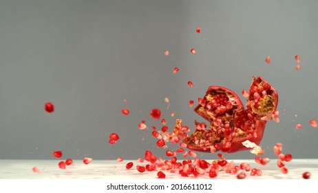 Splashes Of Red Garnet On A Gray Background