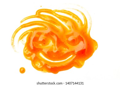Splashes and spilled chilli sauce isolated on white background, Abstract Child Smiling Face. - Shutterstock ID 1407144131