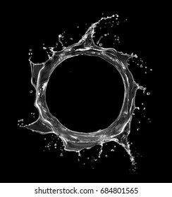 Splashes of water in the shape of a swirling vortex, with place for inscription on black background.