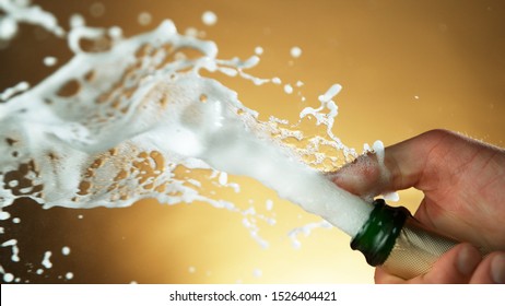 Splashing champagne wine from bottle, celebration still life, New Year's Eve holiday. - Powered by Shutterstock