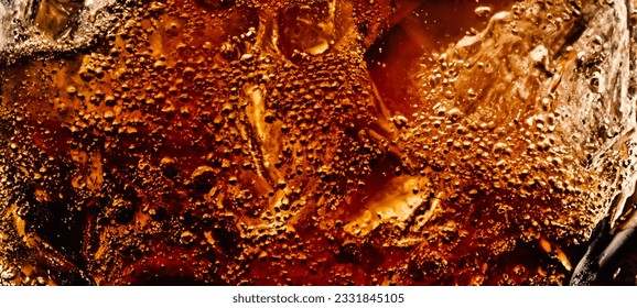 Splashing of Cola and Ice. Cola soda and ice splashing fizzing or floating up to top of surface. Close up of ice in cola water. Texture of carbonate drink with bubbles in glass. Cold drink background