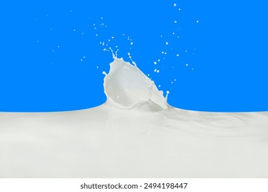 splashing milk isolated on blue background - Powered by Shutterstock