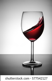 Splashing Red Wine In Glass