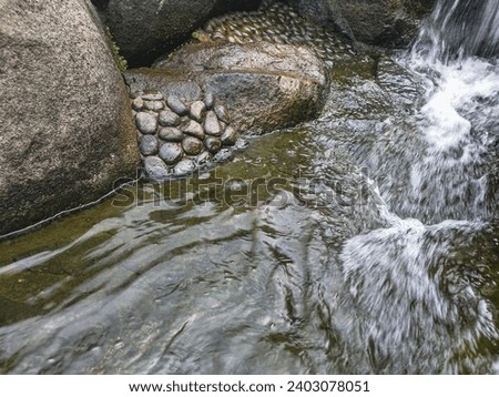 splashing water flowing on the rocks 