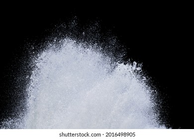 splashing water of sea wave from strom crashing on shore spraying white water foam and bubble in air isolated on black background with clipping path