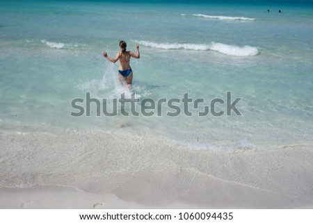 Splashing in the water at Veradero Beach in Cuba