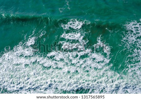 Similar – woman in red swimsuit walks by the sea. blurred