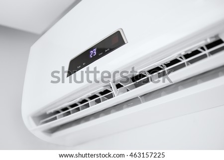 Split air conditioner on a white wall. Closeup image.