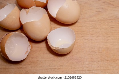 Split Chicken Egg Shells On A Kitchen Board