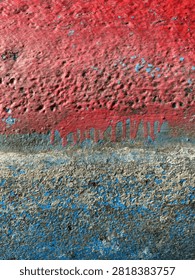 Split color texture transition between weathered red and blue paint on boat hull