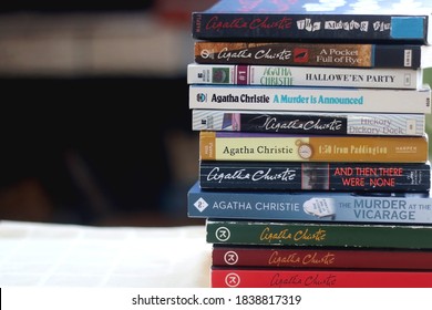 Split, Croatia - October 10, 2020: Stack of Agatha Christie's mystery books on the table. Selective focus.