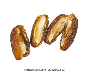Split dried dates with pits isolated on black