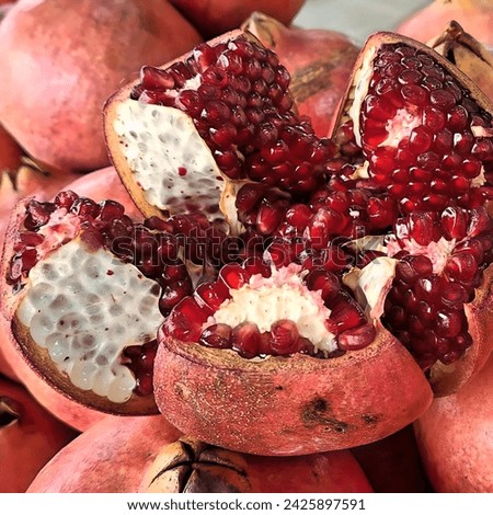 A split open pomegranate, exposing the juicy red arils inside. pomegranate #pomegranates #fruit #healthy #food #delicious #antioxidants #vitamins #minerals #fiber #antiinflammatory #hearthealth 