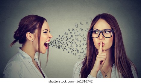 Split personality. Angry young woman screaming at herself with quiet finger on lips gesture. Negative human emotion face expression 