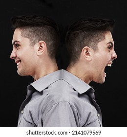 Split personality. Studio shot of a young man showing two sides of his personality.